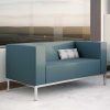 Blue grey two seater sofa with a cream and blue cushion