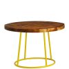 Round coffee table with dark wooden top and yellow legs