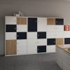 A wall of storage lockers with brown, black and white doors