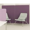 Purple office screens behind two soft grey chairs