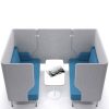 Blue and grey four seater booth with white table