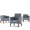 Three armchairs with blue geometric patterned seats and grey backs and sides