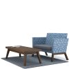 Dark wooden rectangular table with blue geometric patterned sofa