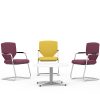 Three meeting chairs - two purple, one yellow - around a white coffee table