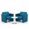 2 blue armchairs and coffee table