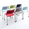 Six stacking chairs in various colours